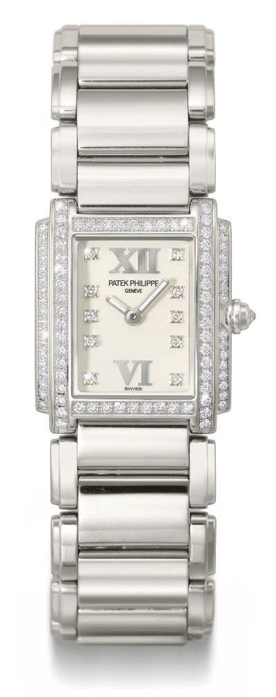Patek Philippe. A lady's fine 18K white gold and diamond-set rectangular wristwatch with bracelet