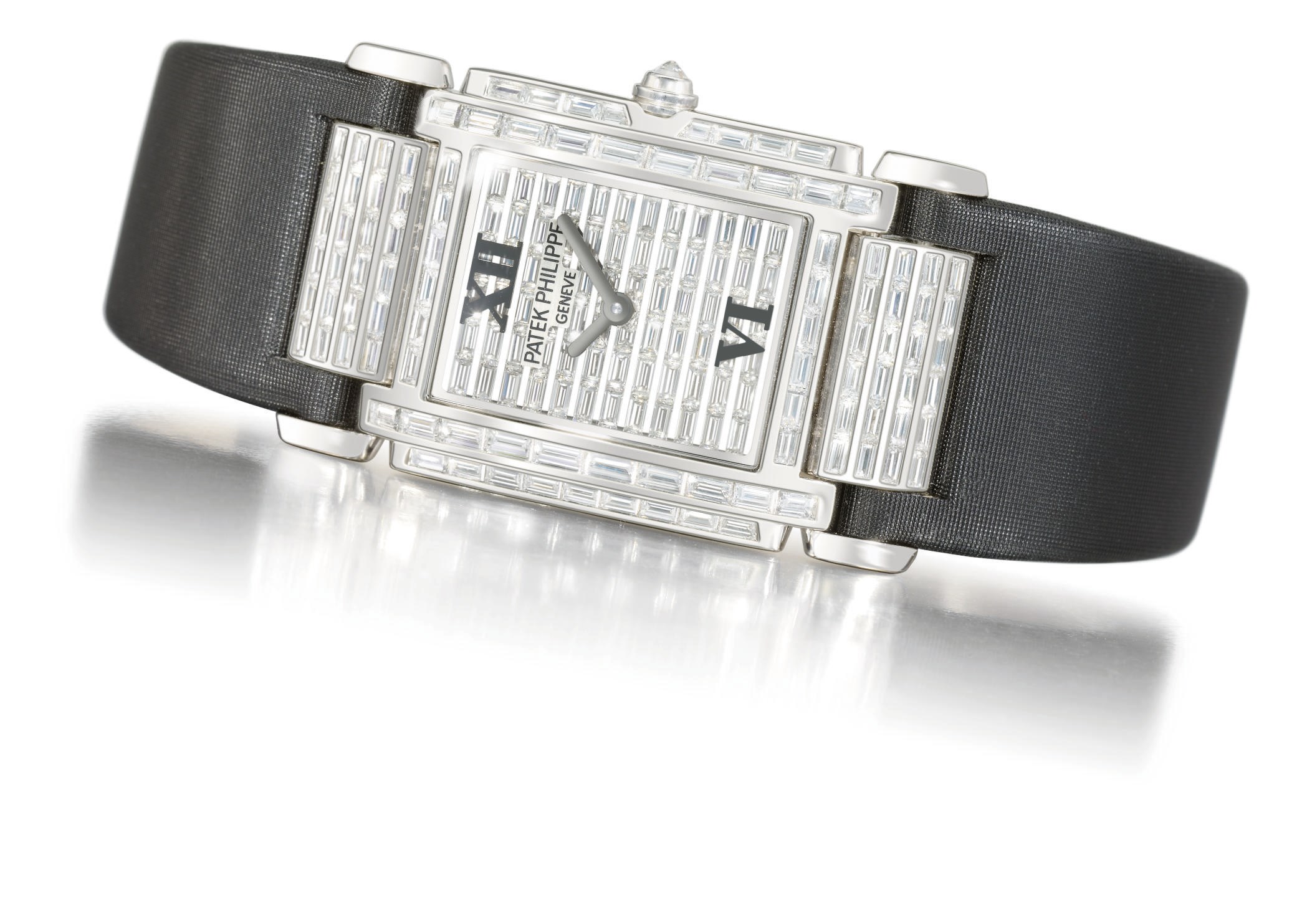 Patek Philippe. A lady's very fine and impressive 18K white gold and diamond-set rectangular wristwatch