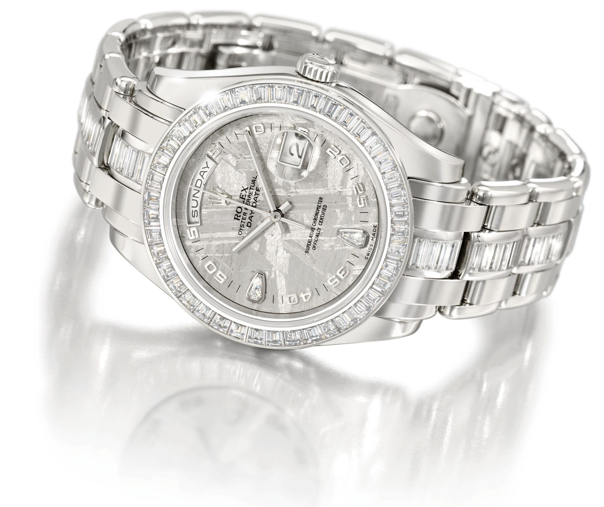 Rolex. An extremely fine and impressive platinum and diamond-set automatic wristwatch with sweep centre seconds, day, date, meteorite dial and bracelet