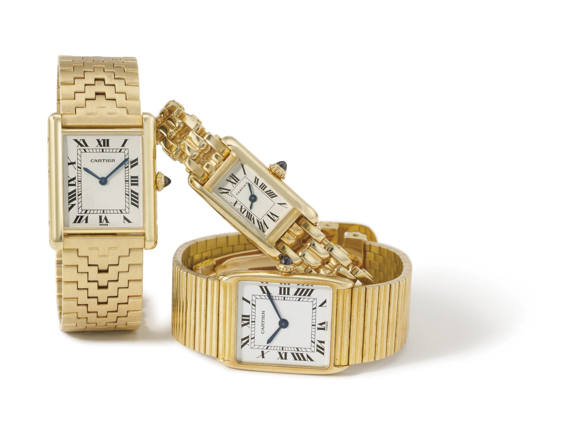 Cartier. A group of three 18K gold rectangular wristwatches with bracelets