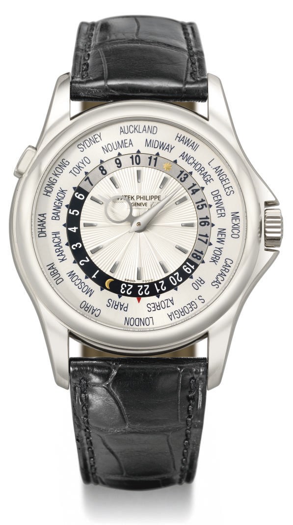 Patek Philippe. A fine 18K white gold automatic World Time wristwatch with original certificate and sales tag
