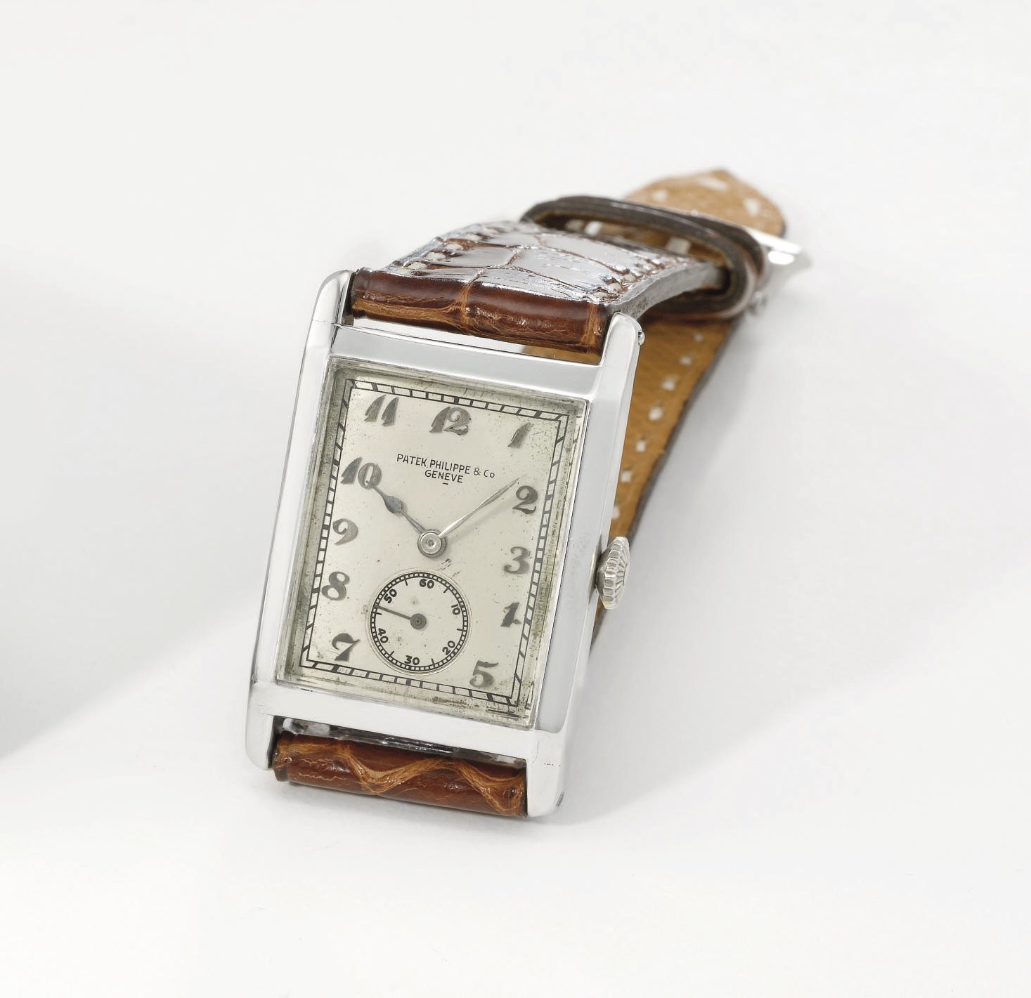 Patek Philippe. A fine 18K white gold rectangular hinged wristwatch with Breguet numerals