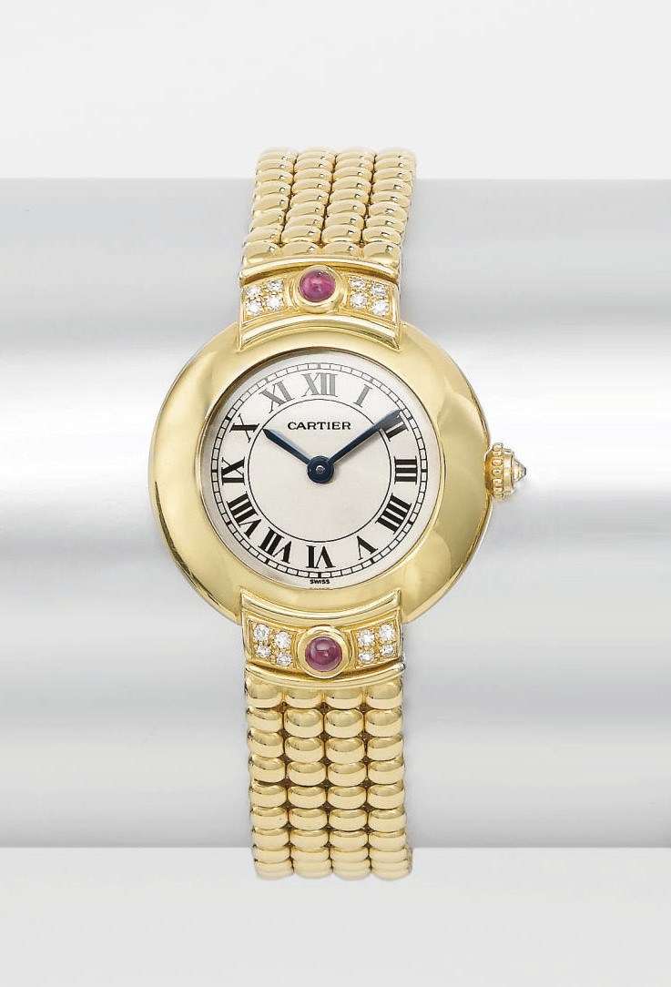 Cartier. A lady's 18K gold, diamond and ruby-set wristwatch with bracelet
