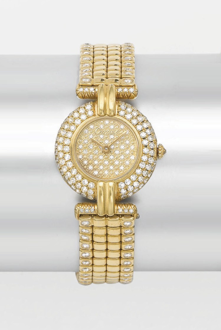 Cartier. A lady's 18K gold and diamond-set wristwatch with bracelet