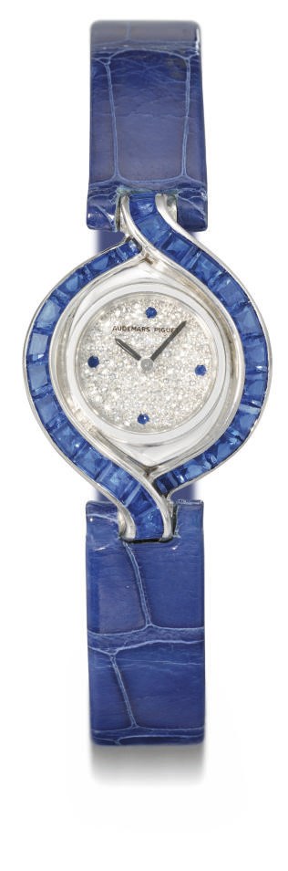 Audemars Piguet. A lady's fine and unusual 18K white gold, diamond and sapphire-set oval wristwatch