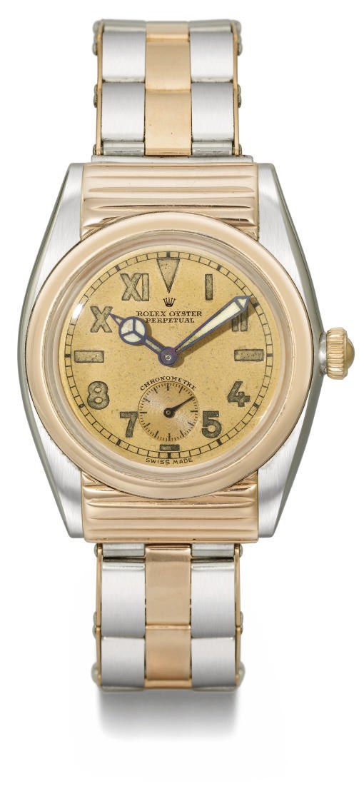 Rolex. A very rare and attractive stainless steel and pink gold automatic bubble back wristwatch with ribbed hooded lugs, pink California dial and bracelet