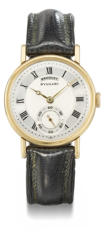 Breguet. An 18K gold wristwatch