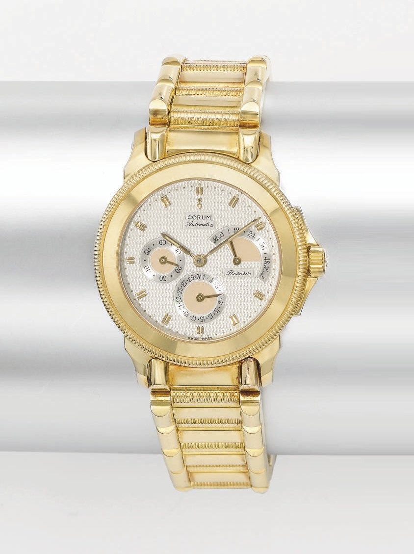 Corum. An 18K gold automatic wristwatch with date and power reserve