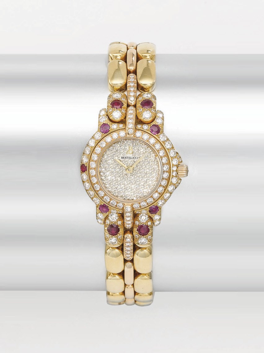 Bertolucci. A lady's fine 18K two colour gold, diamond and ruby-set wristwatch with bracelet
