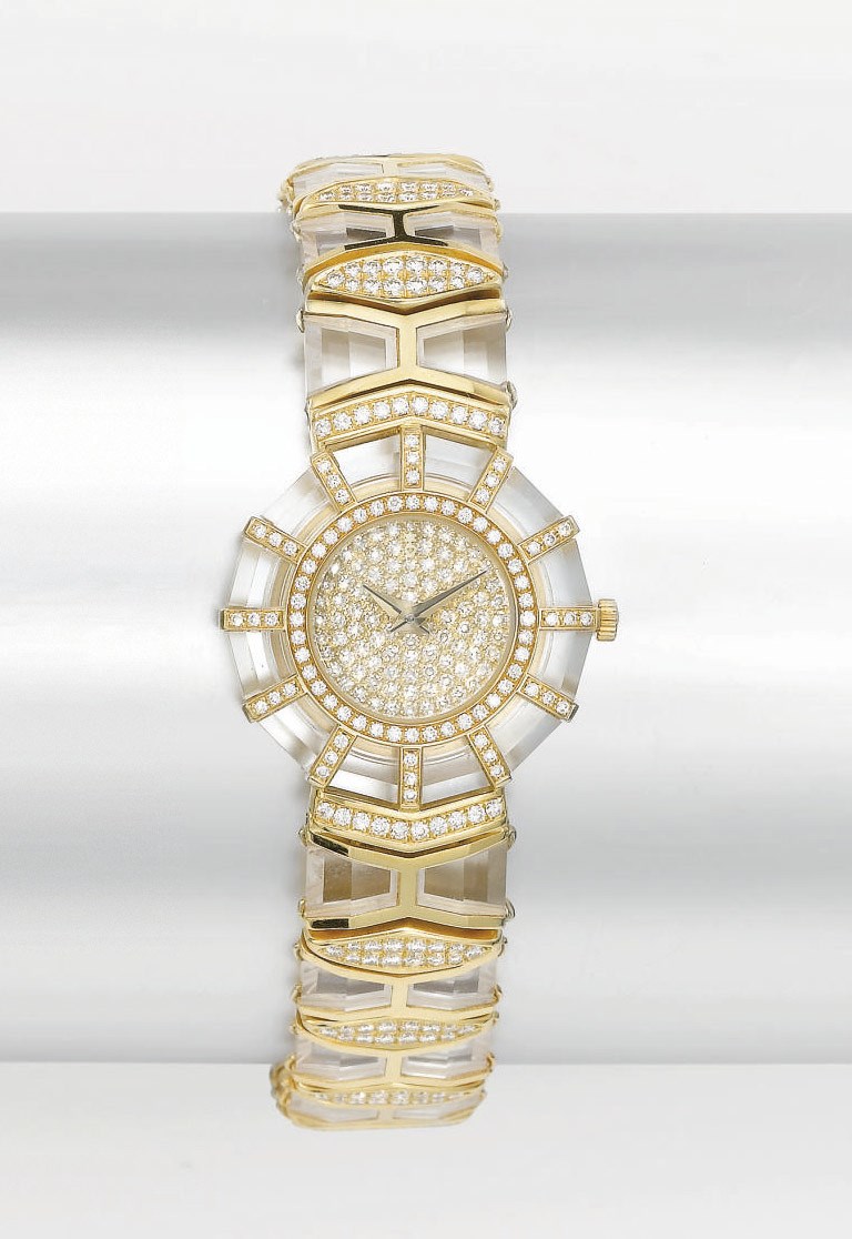 Corum. A lady's fine and unusual 18K gold, rock crystal and diamond-set polygonal wristwatch with bracelet