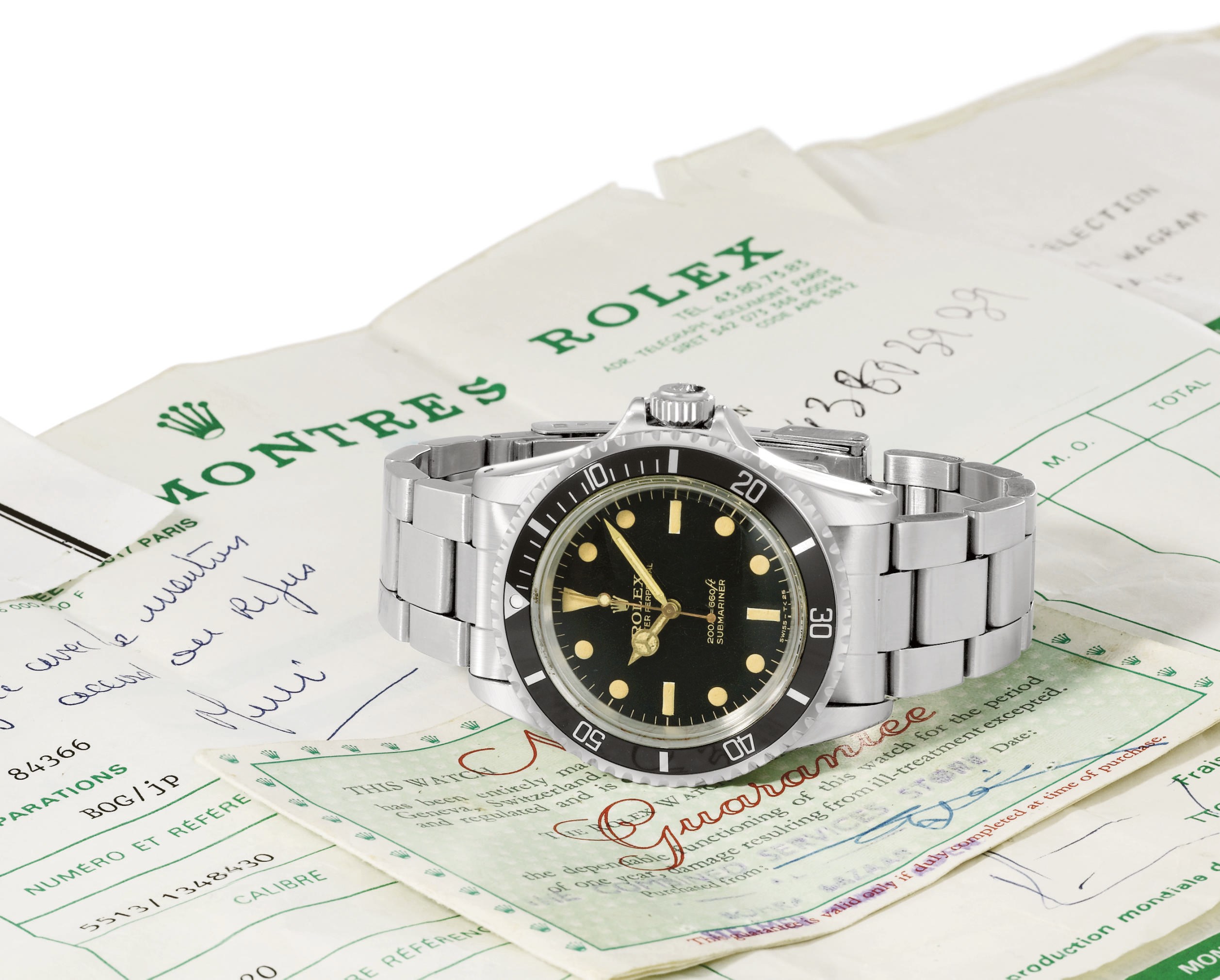 Rolex. A fine and rare stainless steel automatic wristwatch with sweep centre seconds, bracelet, original guarantee and servicing invoice