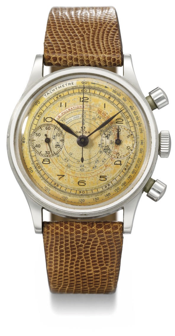 Omega. An unusual stainless steel chronograph wristwatch with gilt dial and pulsometre