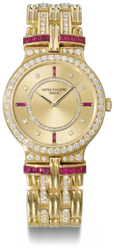 Patek Philippe. A fine, rare and unusual 18K gold, diamond and ruby-set wristwatch with bracelet