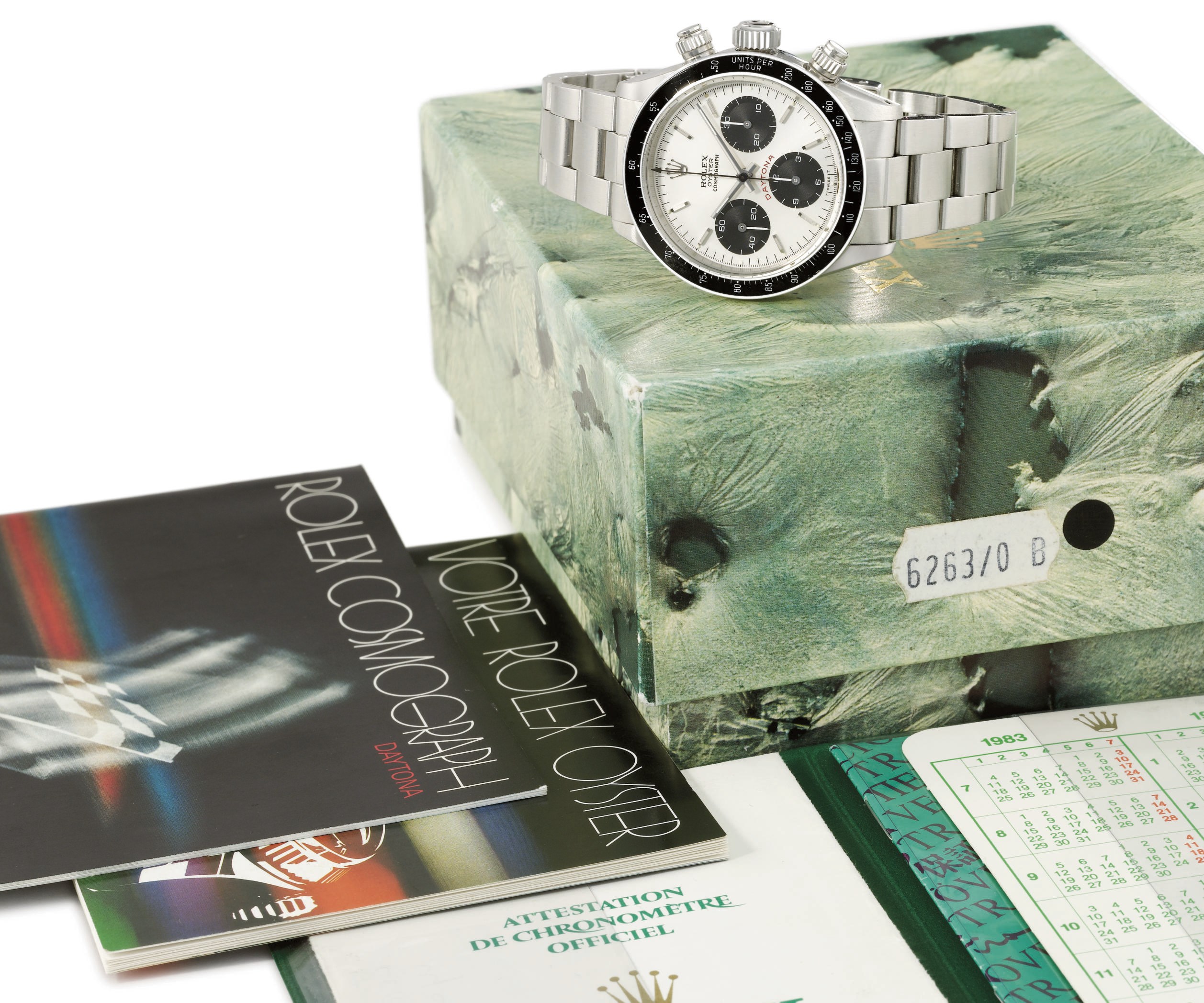 Rolex. A stainless steel chronograph wristwatch with bracelet, original Guarantee, invoice and box