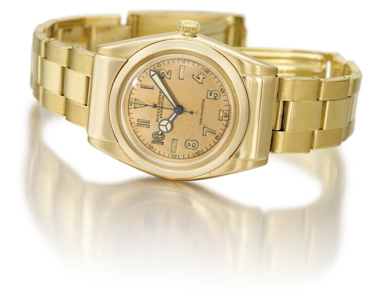 Rolex. A fine and rare 14K gold automatic bubble back wristwatch with sweep centre seconds, salmon dial, hooded lugs and bracelet