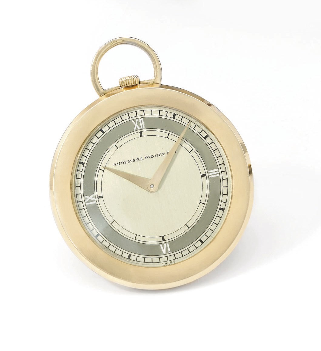 Audemars Piguet. A slim 18K pink gold openface keyless lever dress watch with unusual two-tone champagne dial