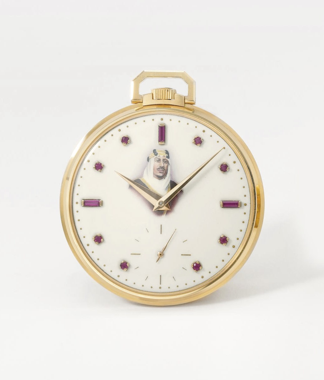 Patek Philippe. A very fine and rare 18K pink gold openface keyless lever watch with ruby-set enamel dial with the portrait of King Saud bin Abdul Aziz