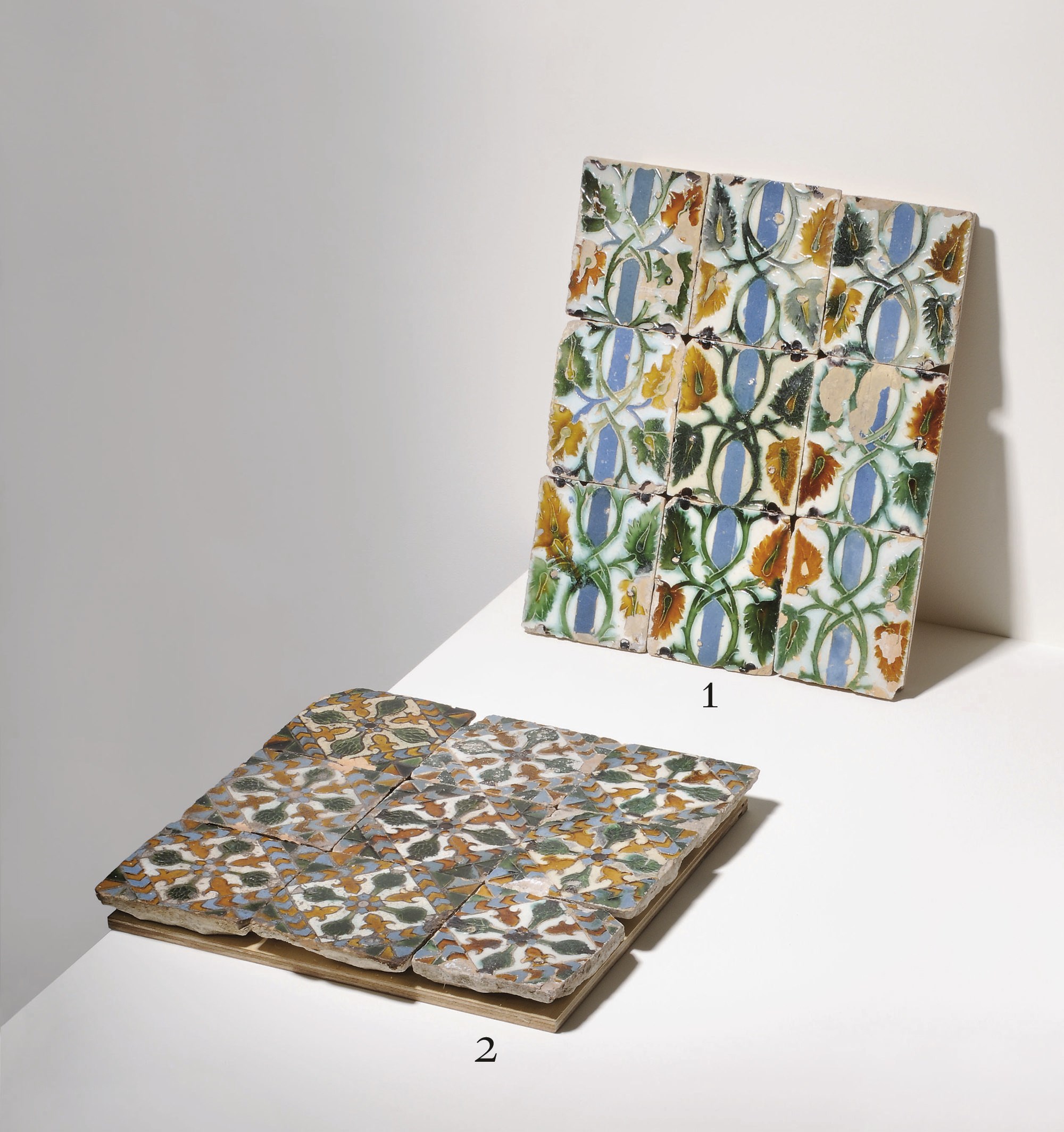 A PANEL OF NINE SPANISH POTTERY CUERDA SECA RECTANGULAR TILES