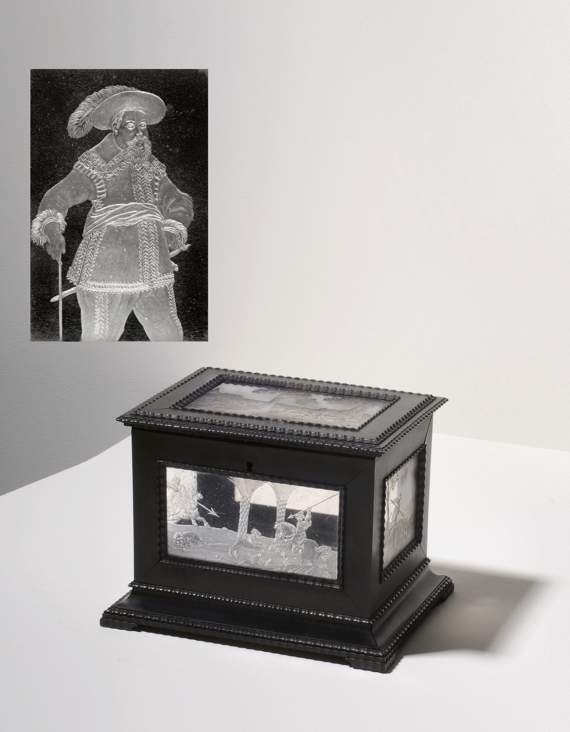 A CONTINENTAL ENGRAVED-GLASS-MOUNTED EBONY AND EBONISED WOOD RECTANGULAR CASKET AND COVER