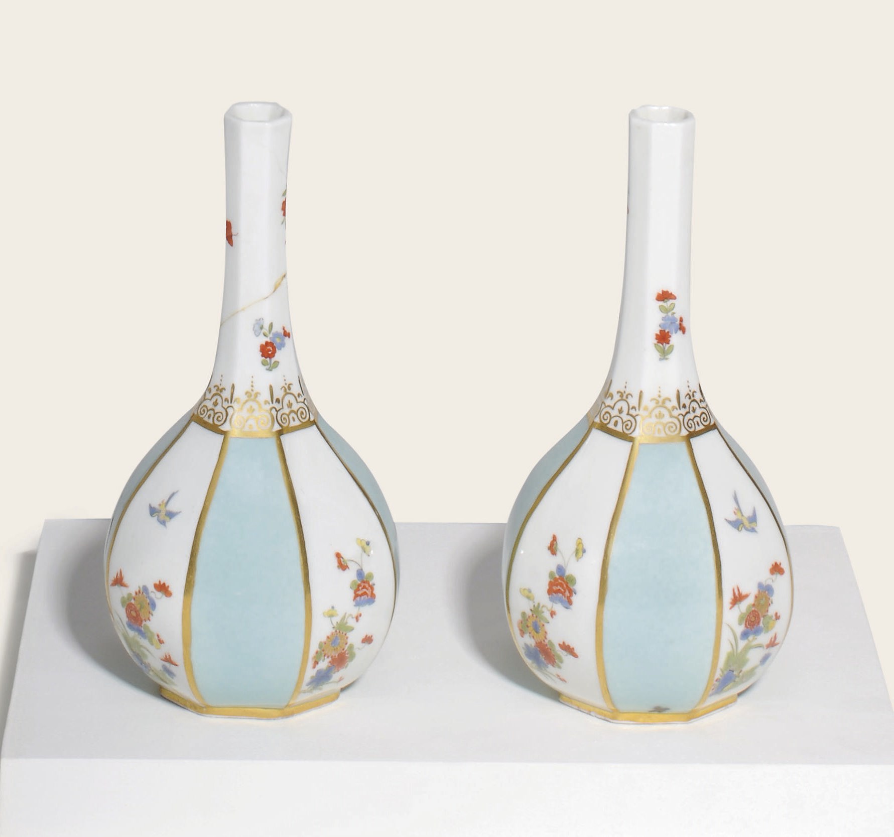 A PAIR OF MEISSEN PORCELAIN ROYAL SELADON-GROUND OCTAGONAL BOTTLE-VASES