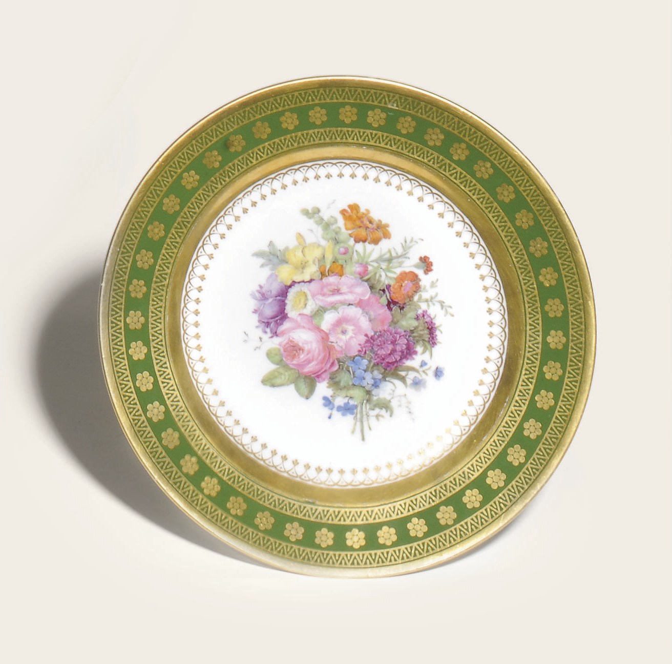 A SEVRES PORCELAIN GREEN-GROUND PLATE FROM EMPRESS JOSEPHINE'S SERVICE A FLEURS