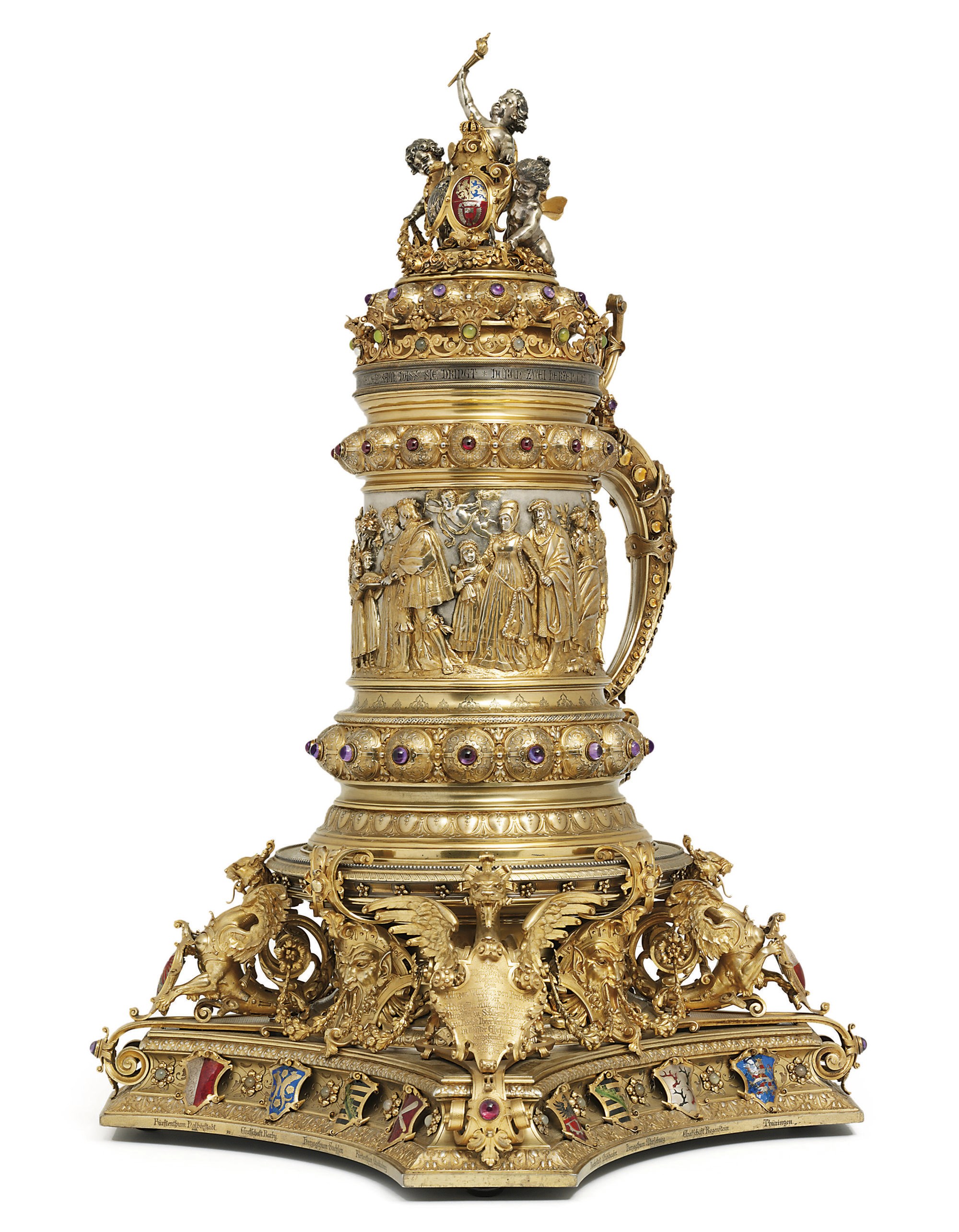 A MONUMENTAL GERMAN PARCEL-GILT, GEM-SET AND ENAMEL SILVER TANKARD AND STAND
