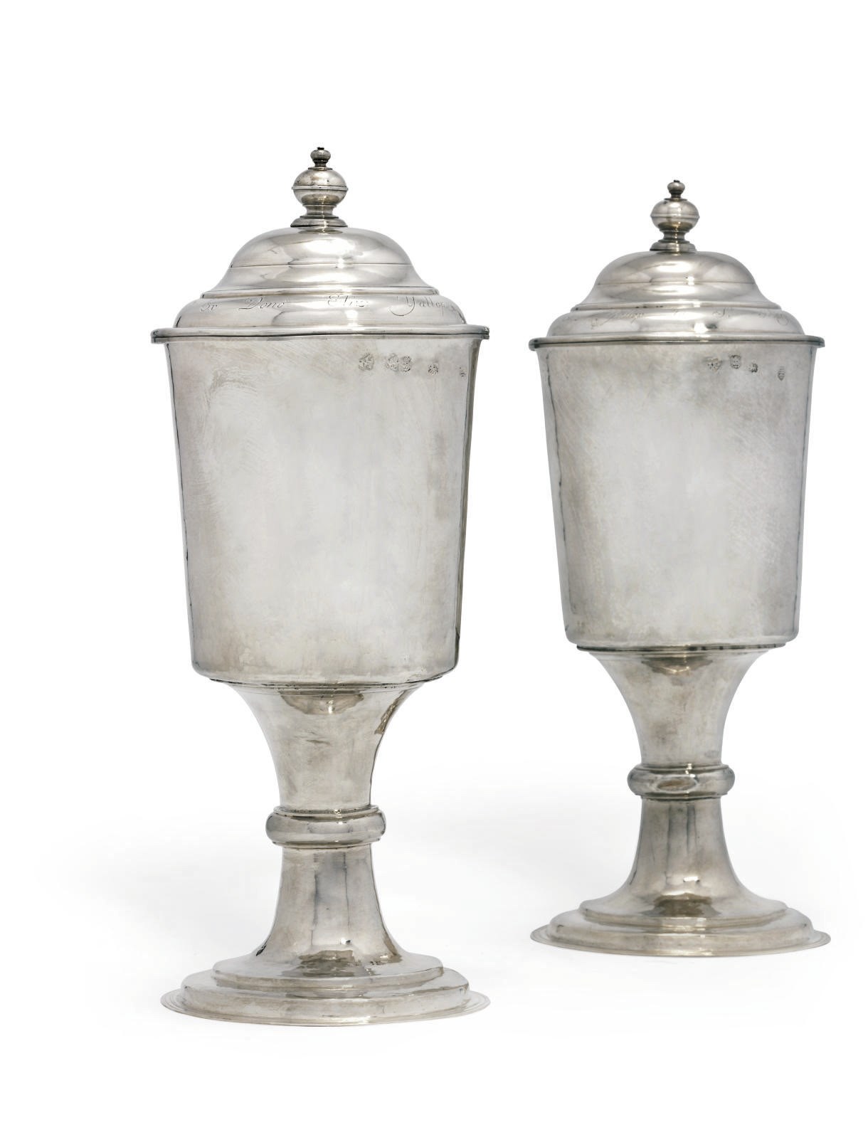 A PAIR OF CHARLES II SILVER COMMUNION CUPS WITH GEORGE II SILVER COVERS
