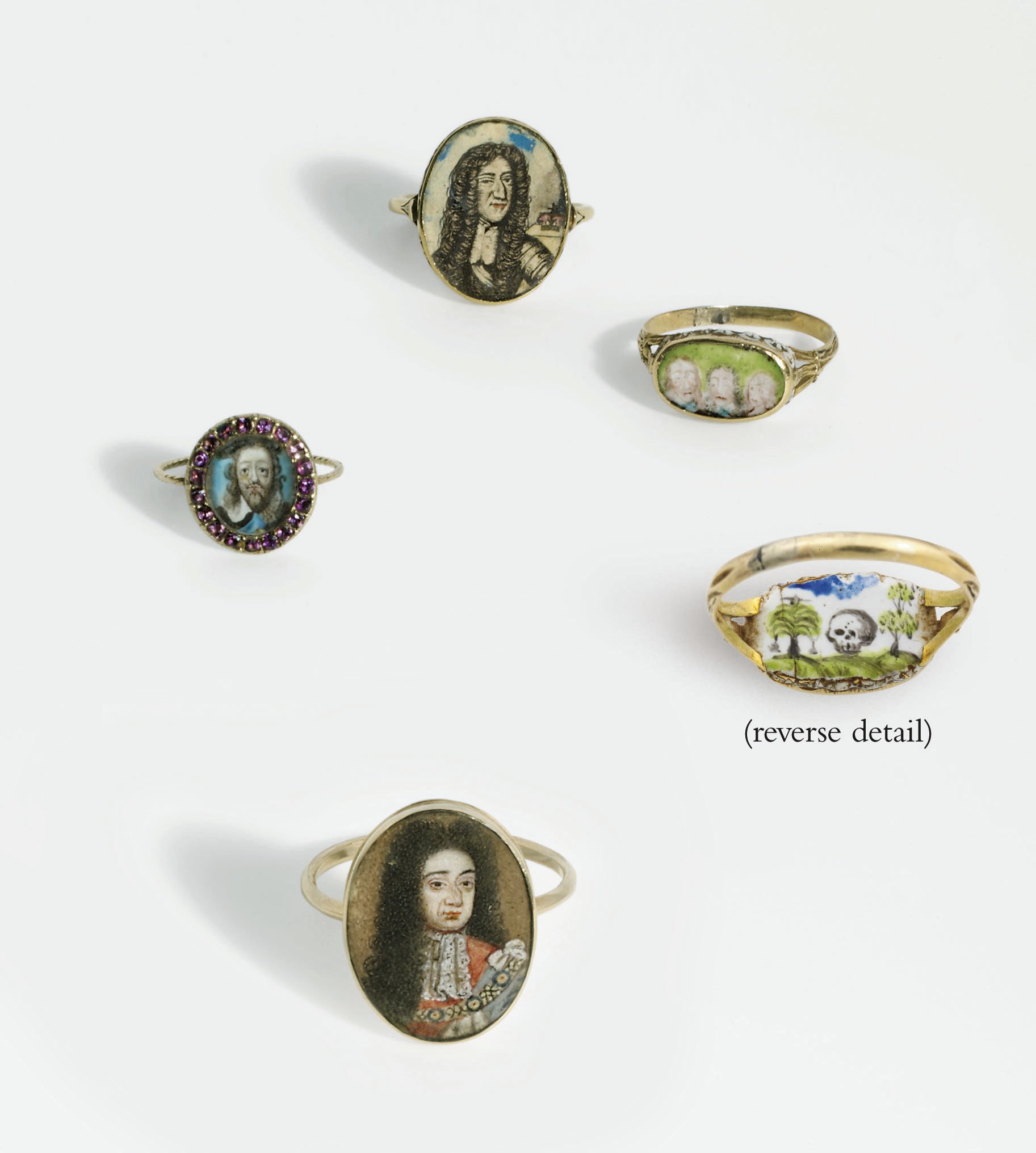 FOUR GOLD MEMORIAL RINGS FOR CHARLES I, CHARLES II AND WILLIAM III
