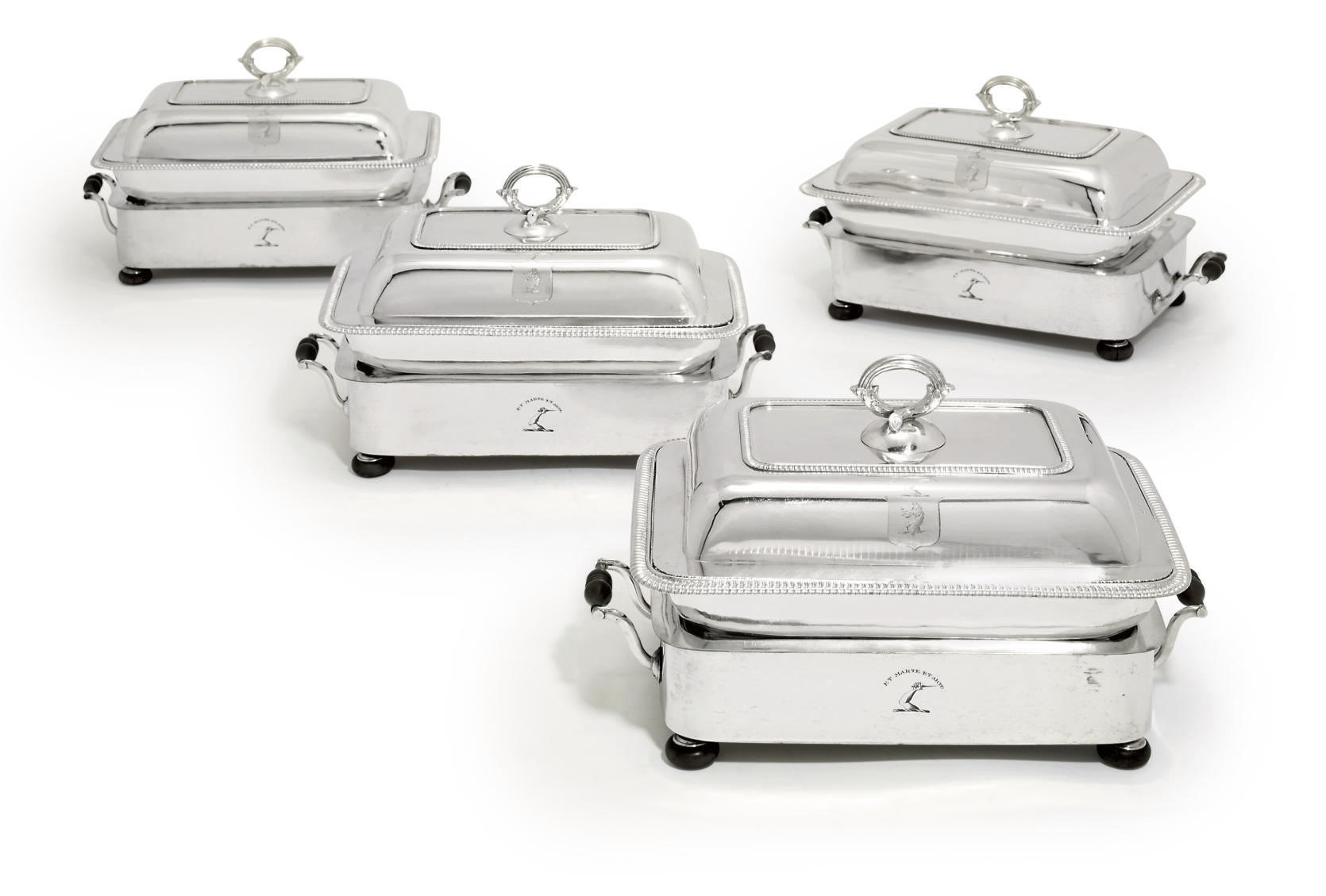 A SET OF FOUR GEORGE III SILVER ENTREE DISHES AND COVERS WITH OLD SHEFFIELD PLATE STANDS