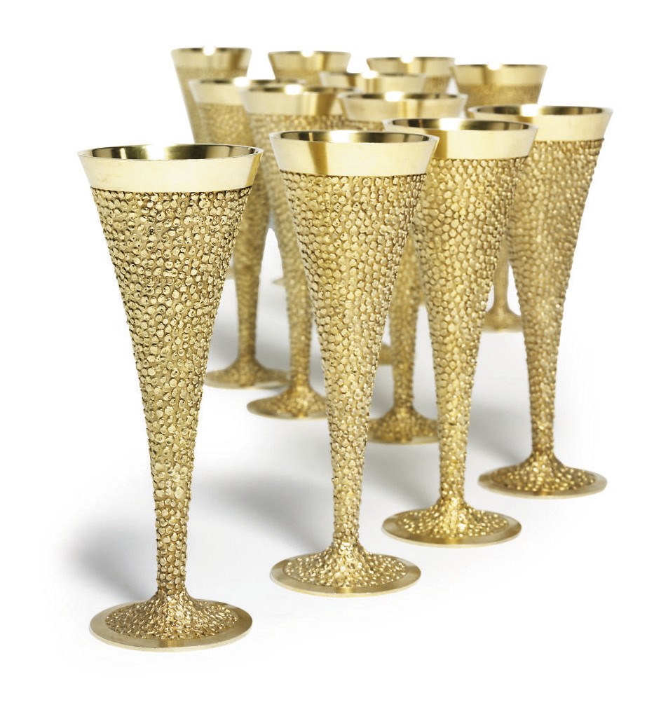 A SET OF TWELVE ELIZABETH II SILVER-GILT GOBLETS