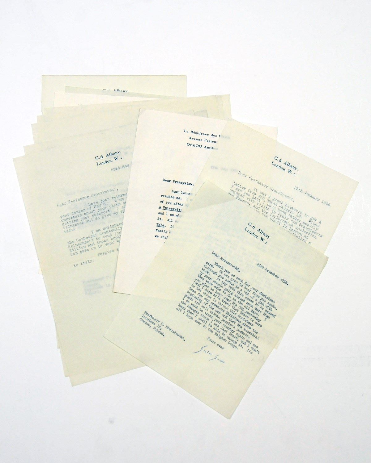 GREENE, Graham (1904-1991). A series of 11 typed letters signed ('Graham Greene', 'Graham') to Professor Przemyslaw Mroczkowski, C6 Albany, London and La Résidence des Fleurs, Antibes, 25 January 1956 - 25 July 1988 (all but two before 1960), referring to their meeting in Cracow, his gifts of books (including an inscribed copy of Murder in the Cathedral), the preparations for a stage production of The Power and the Glory, and a trip to the Belgian Congo, 'I am about half way through a novel set in a leproserie of the Belgian Congo [A Burnt Out Case]', together 11 pages, 4to, with a secretarial letter, and an inscribed copy ('For Professor Mroczkowksi with happy memories of our first meeting in Cracow, Nov. 18, 1955') of The Power and the Glory (Heinemann Pocket Edition, 1945). Provenance: by descent from the recipient. 	 (12)