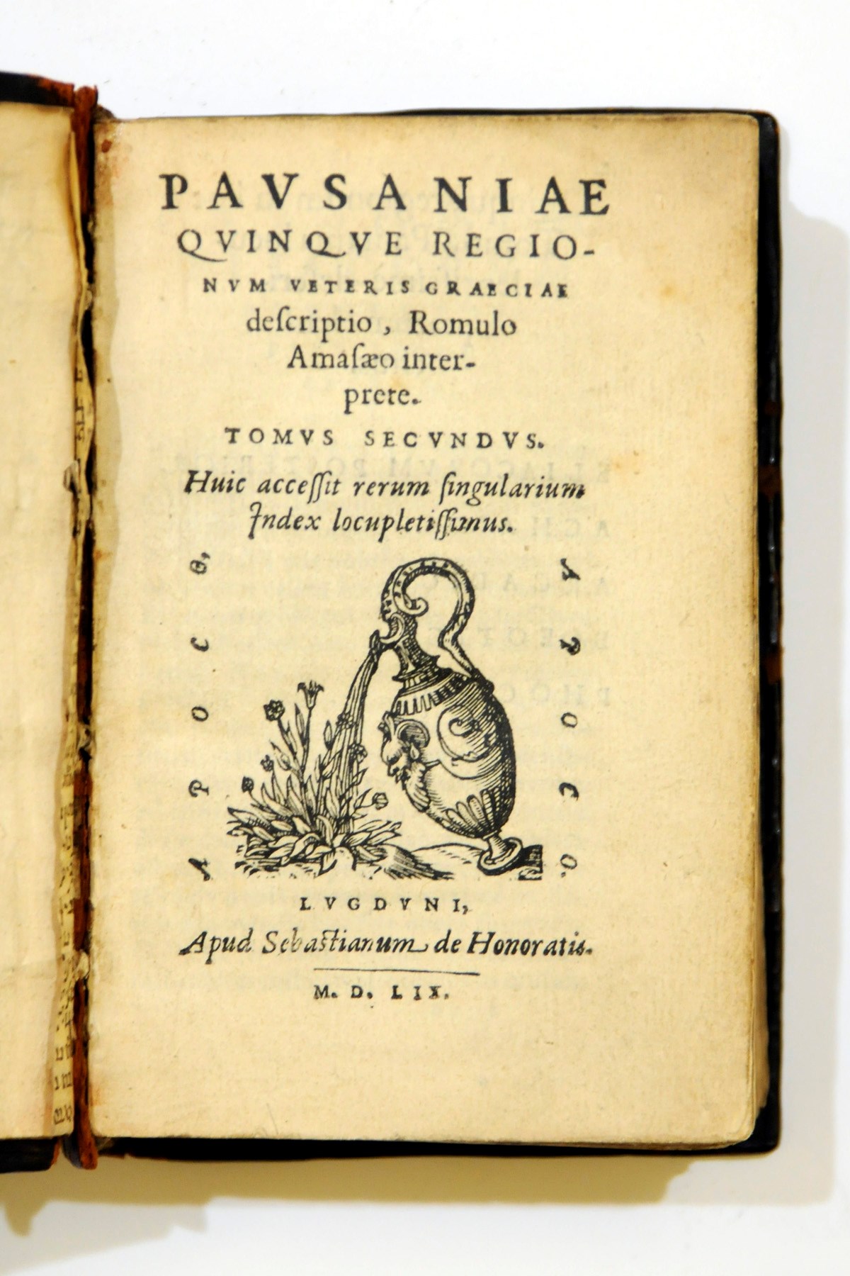 ELIZABETH I -- PAUSANIAS. Quinque regionum veteris Graeceae description. Volume 2 only. Lyons: Sebastian de Honoratis, 1559. 8° (120 x 80mm). Engraved device on the title. (Dampstain in some gatherings, short worm track in a very few leaves.) Contemporary blind-tooled calf, the sides centred with the badge of Queen Elizabeth (rubbed, the sides crackled, front joint starting); cloth clamshell case. Provenance: Elizabeth I (binding) -- Bernard Quaritch (provenance note laid-in) -- Elswyth Thane Beebe (provenance note laid-in).