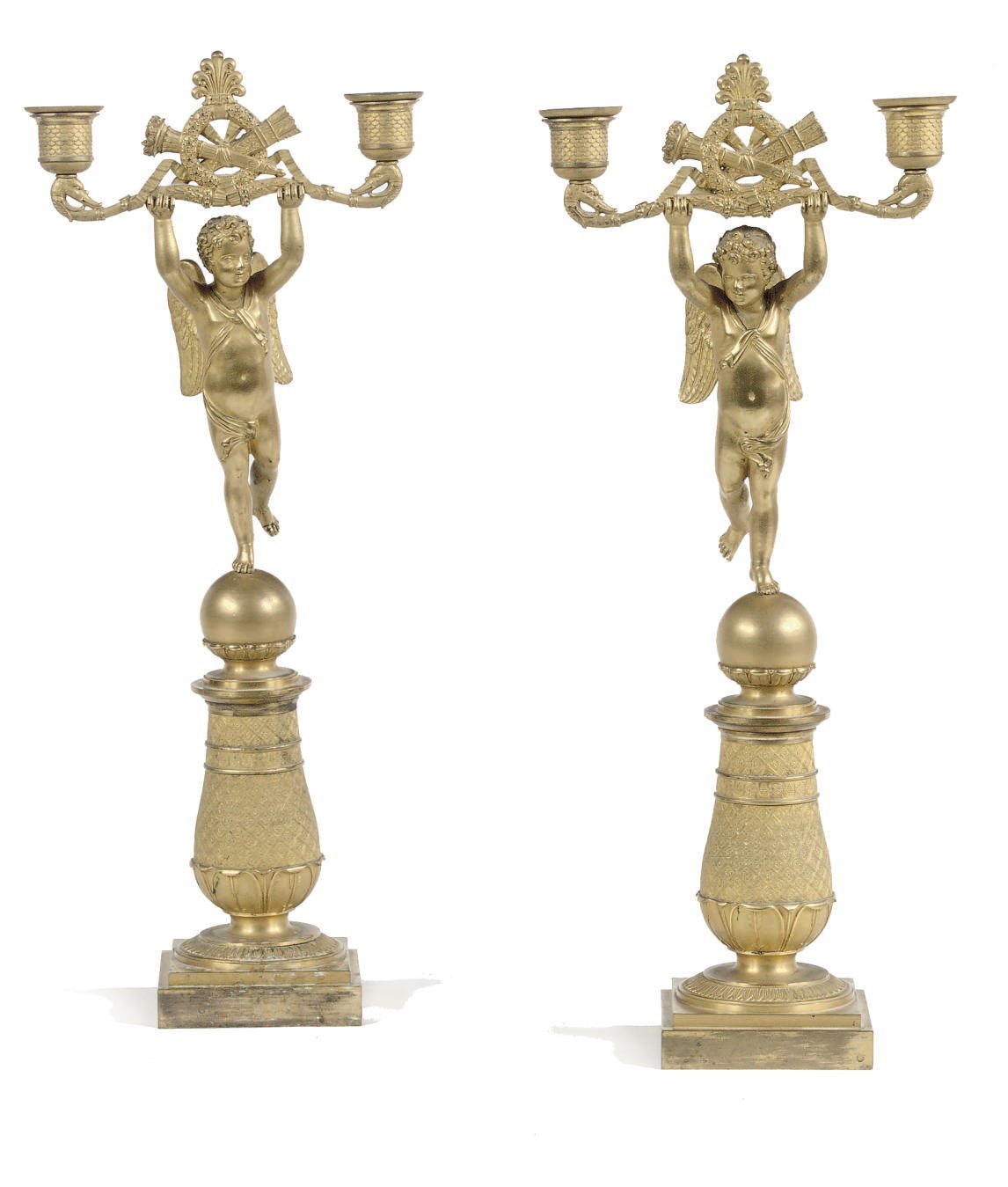 A PAIR OF LOUIS XVIII ORMOLU TWO-LIGHT FIGURAL CANDLESTICKS