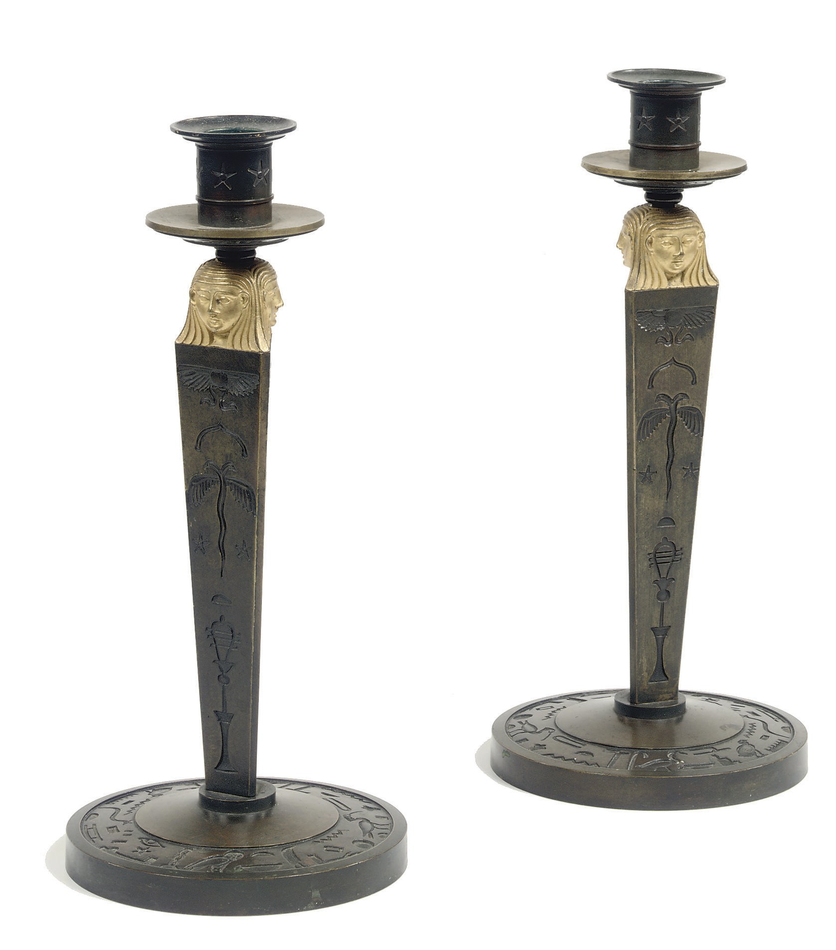A PAIR OF CONSULAT ORMOLU AND PATINATED BRONZE CANDLESTICKS