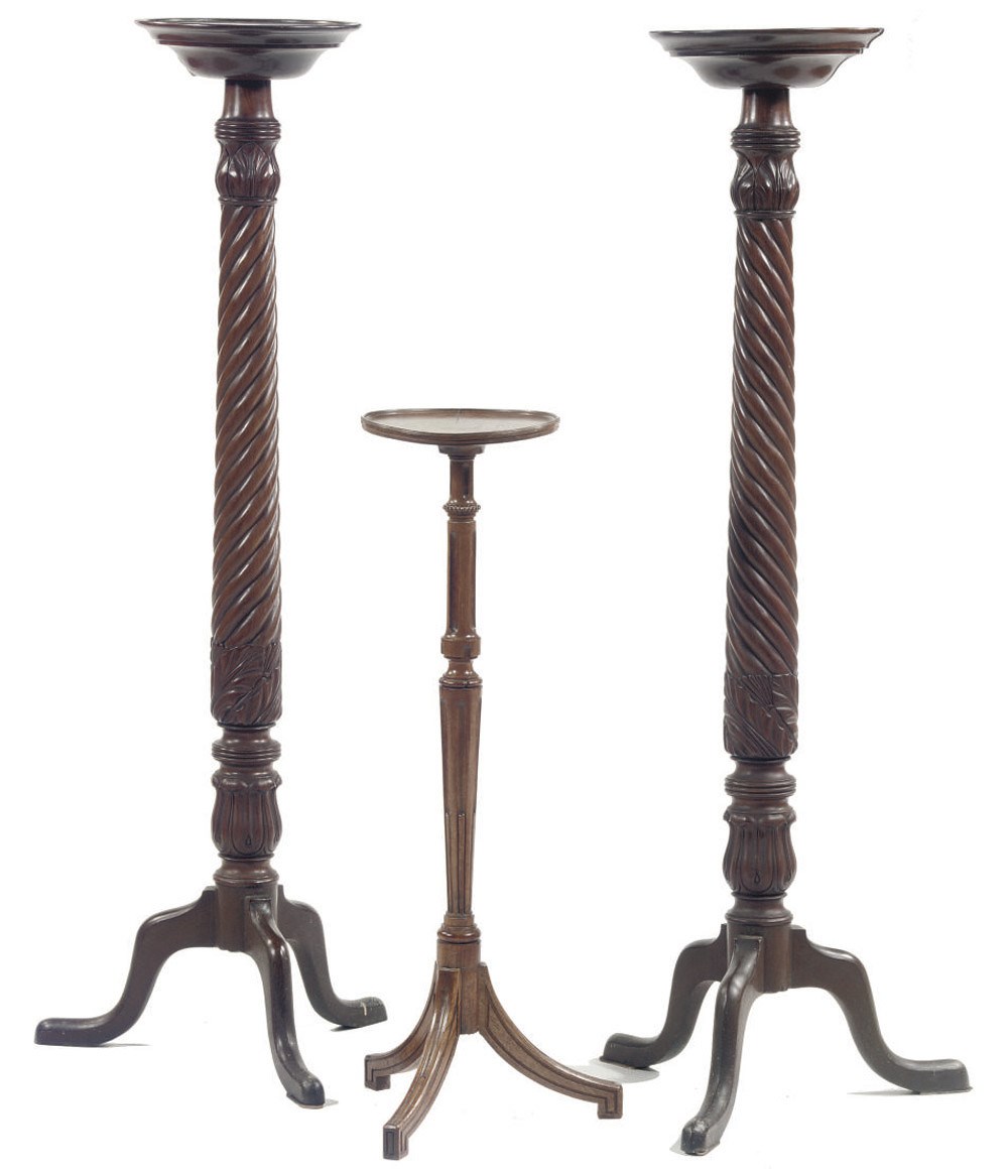 A PAIR OF ENGLISH MAHOGANY TORCHERES