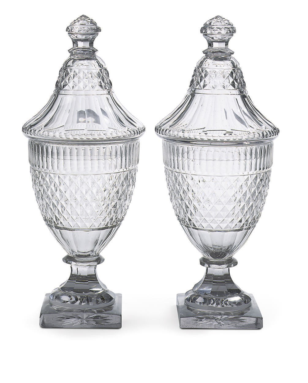 A pair of Baccarat or Voneche glass ginger urn vases and covers