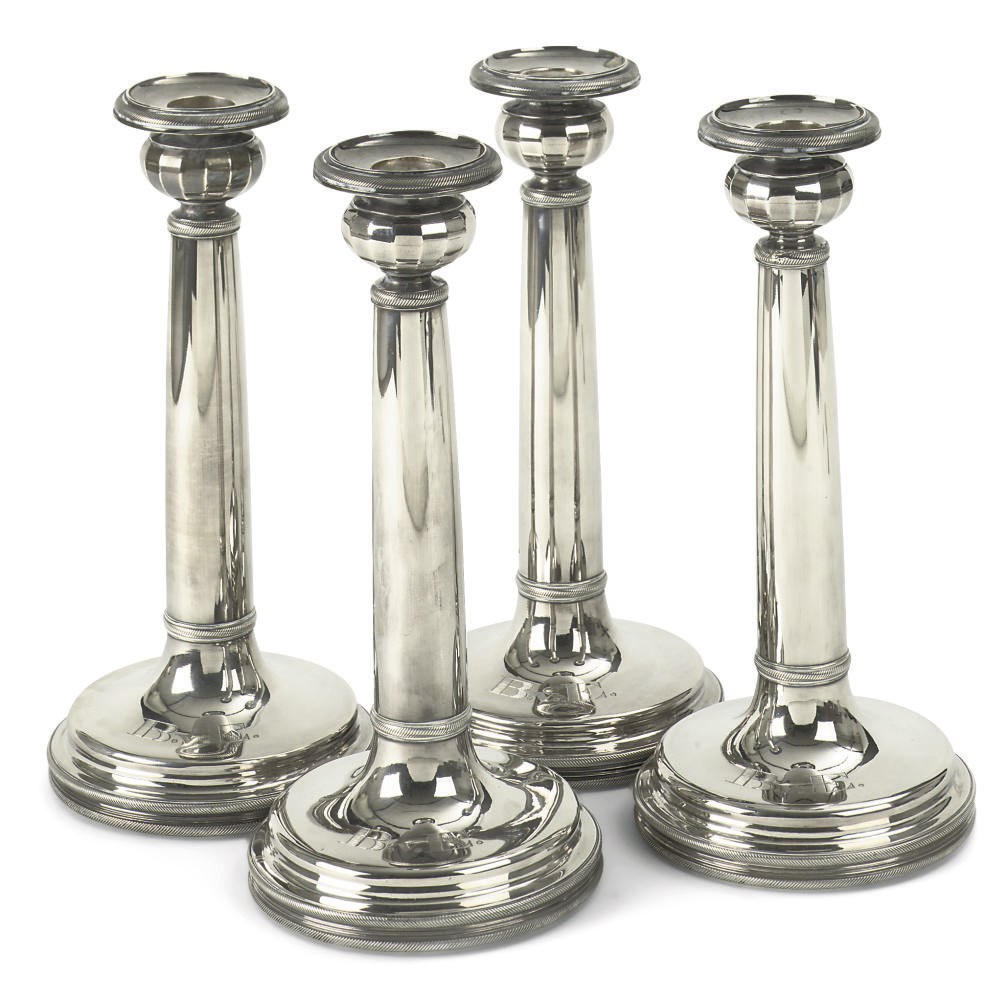A set of four Dutch candlesticks