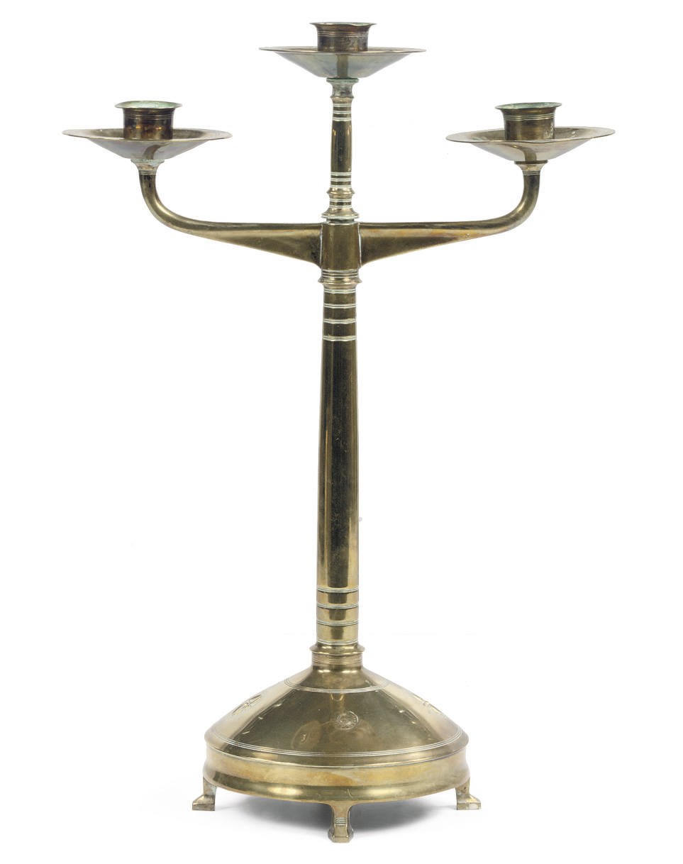A THREE BRANCH BRASS CANDELABRA