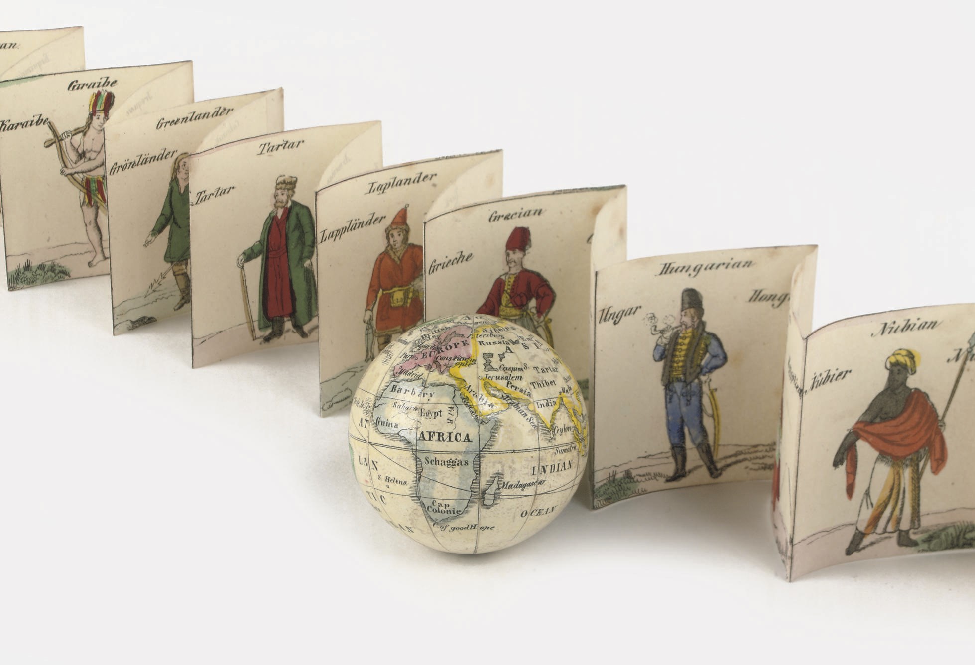 A 1¾-INCH MINIATURE TERRESTRIAL GLOBE