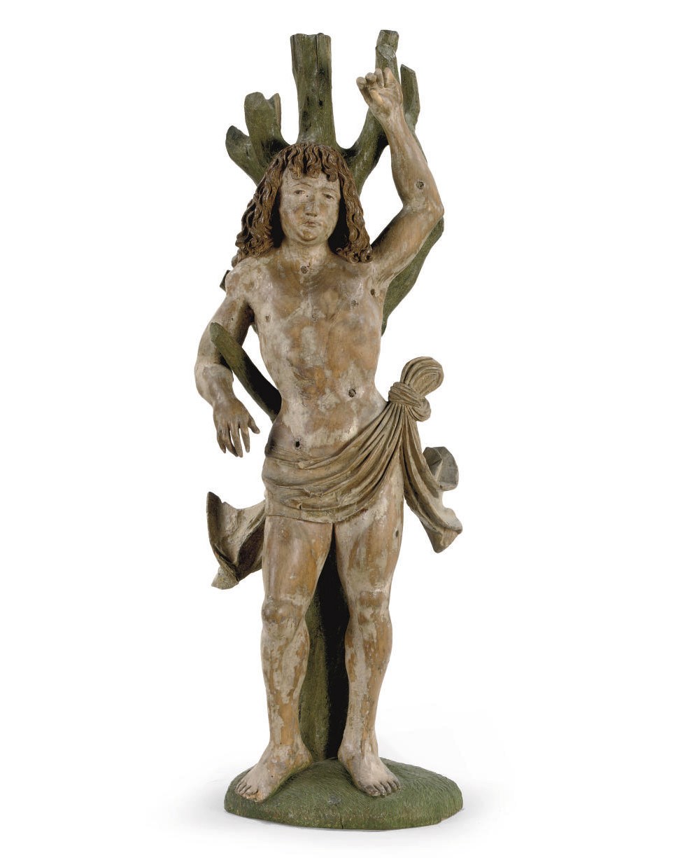 A POLYCHROME CARVED LIMEWOOD FIGURE OF SAINT SEBASTIAN