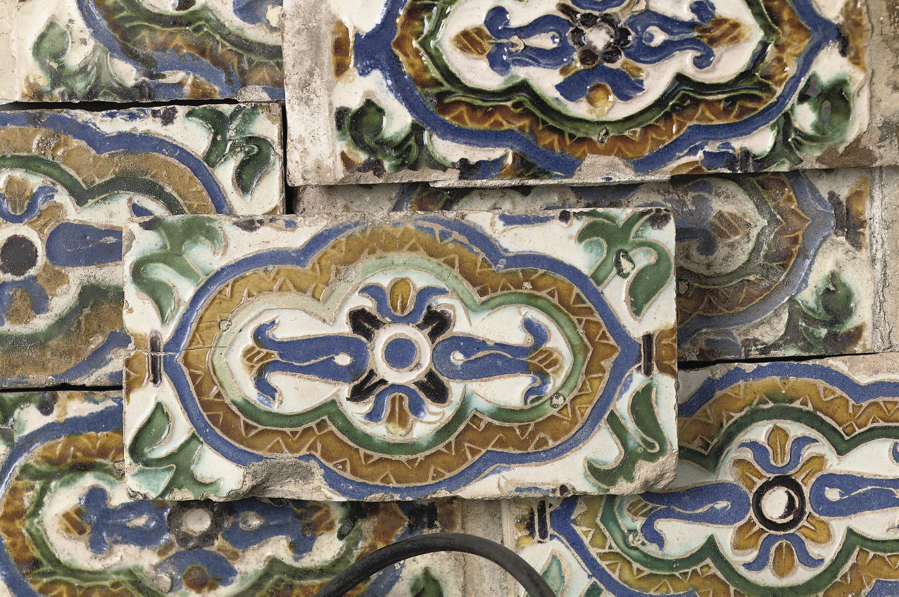 A group of thirteen Spanish cuerda seca tiles