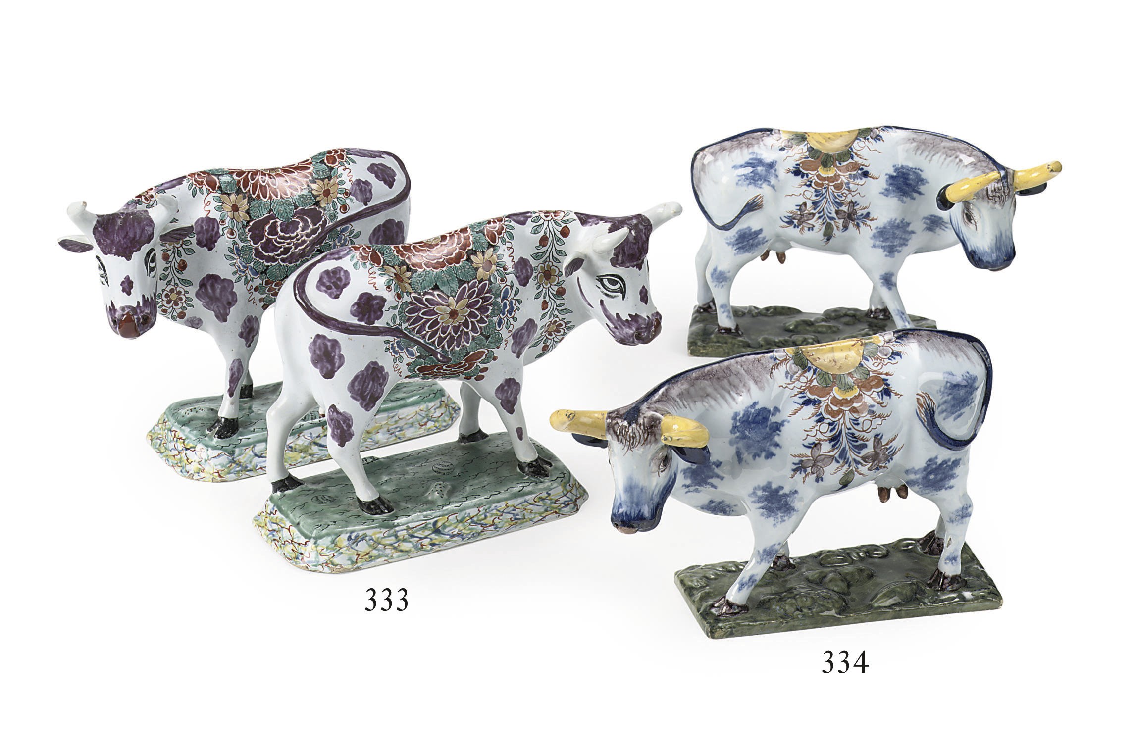 A pair of Dutch Delft polychrome models of standing cows
