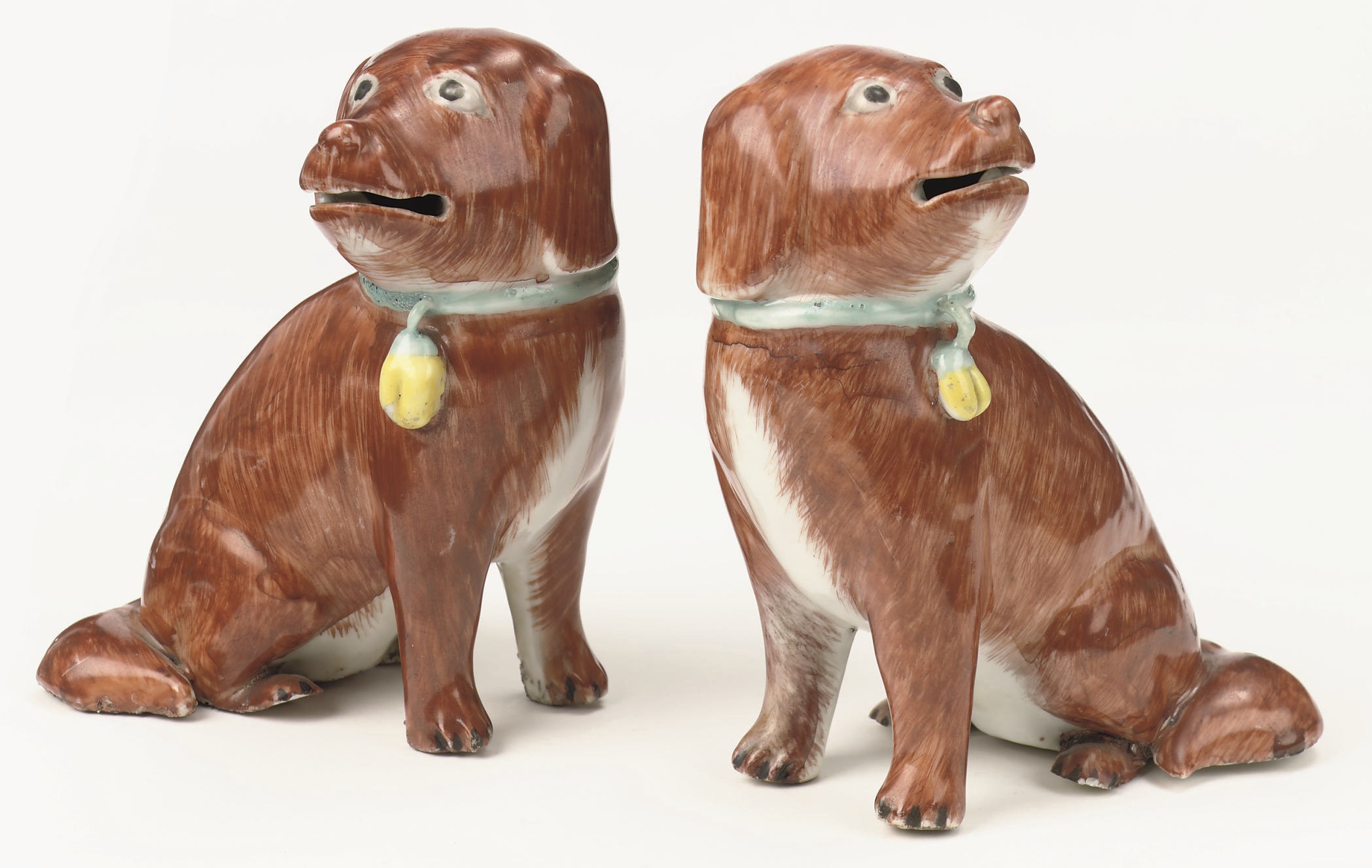 A pair of Chinese Export iron-red figures of puppy hounds