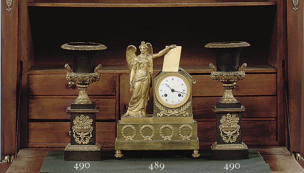 AN EMPIRE ORMOLU FIGURAL STRIKING MANTEL CLOCK