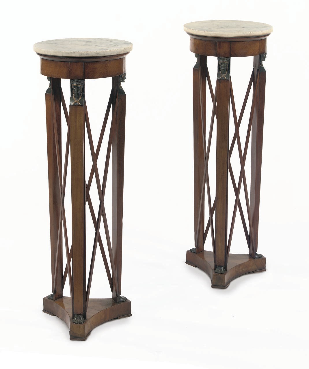 A PAIR OF PARCEL-GILT, BRONZED MAHOGANY GUERIDONS