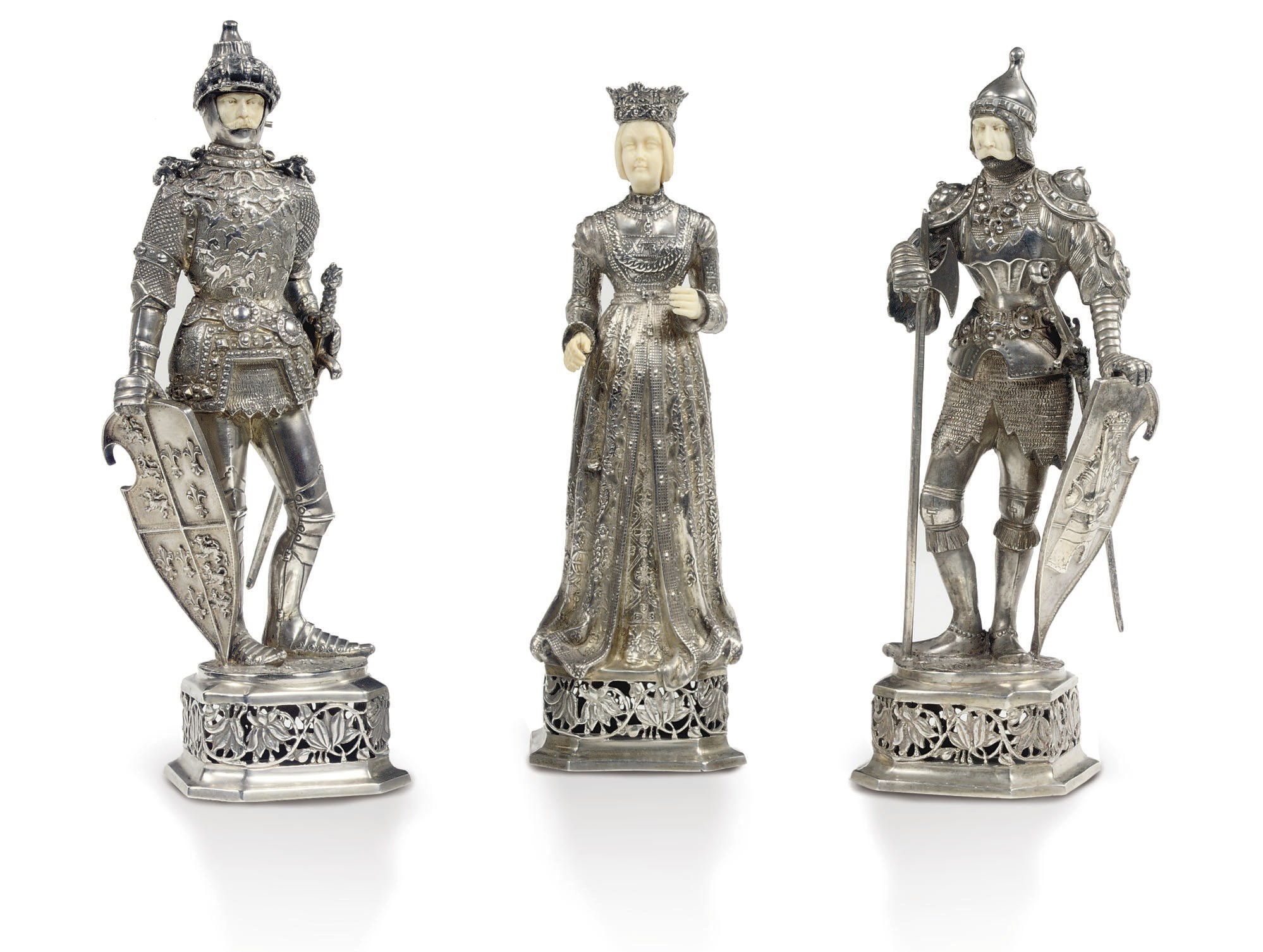 Three German silver and ivory figures of a lady and knights