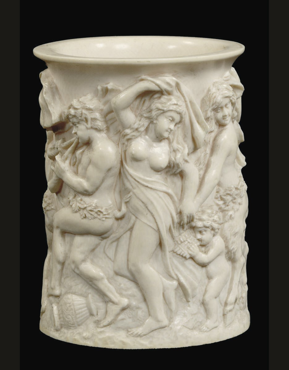 A GERMAN CARVED IVORY TANKARD SLEEVE