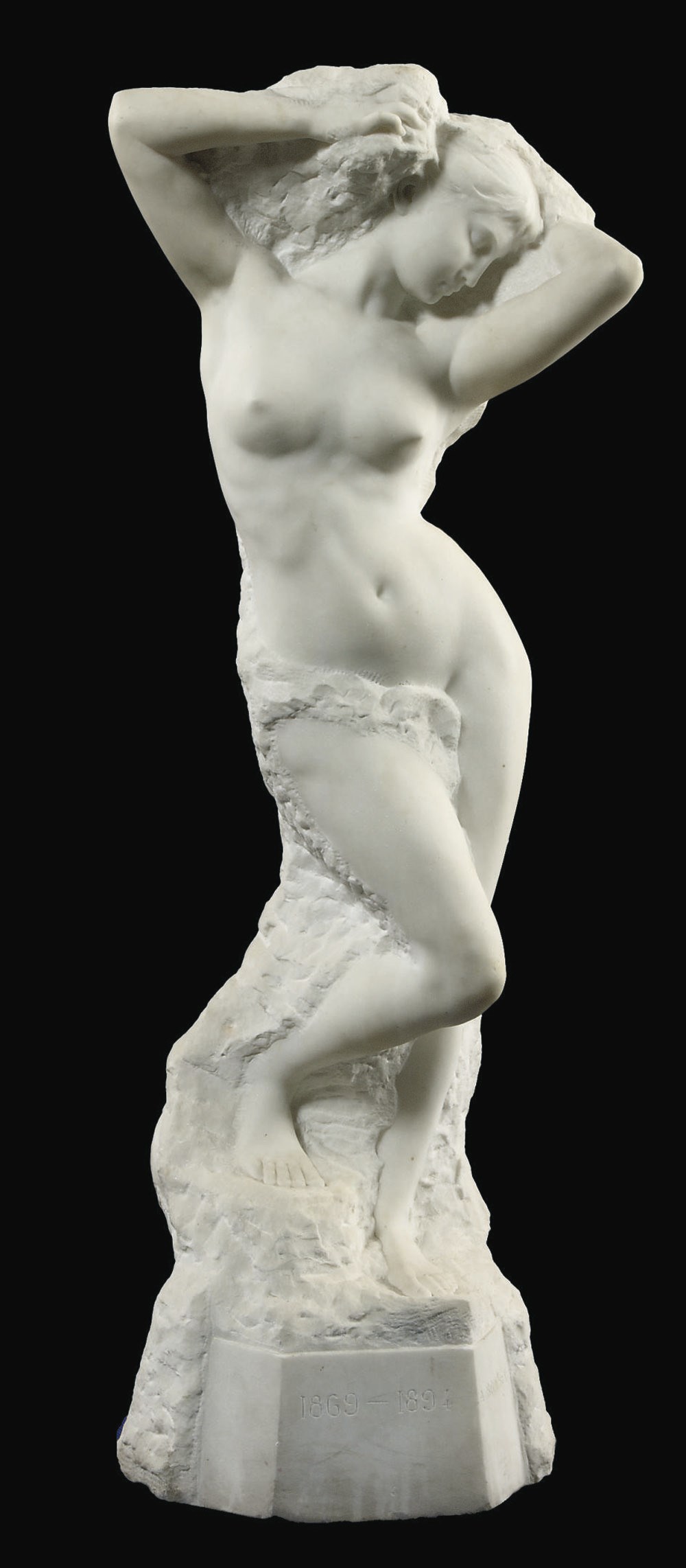 A FRENCH CARVED WHITE MARBLE FIGURE OF A FEMALE NUDE 'VOLUBILIS'