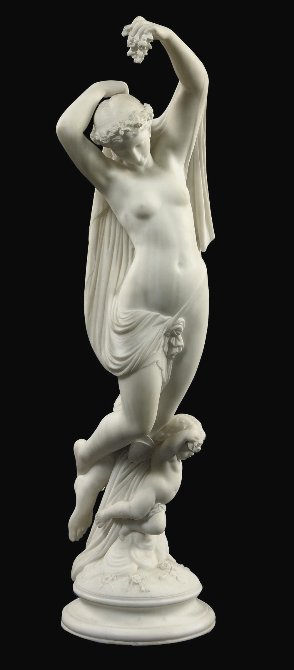 A CARVED MARBLE GROUP OF A FEMALE FIGURE AND A CHILD REPRESENTING FLORA