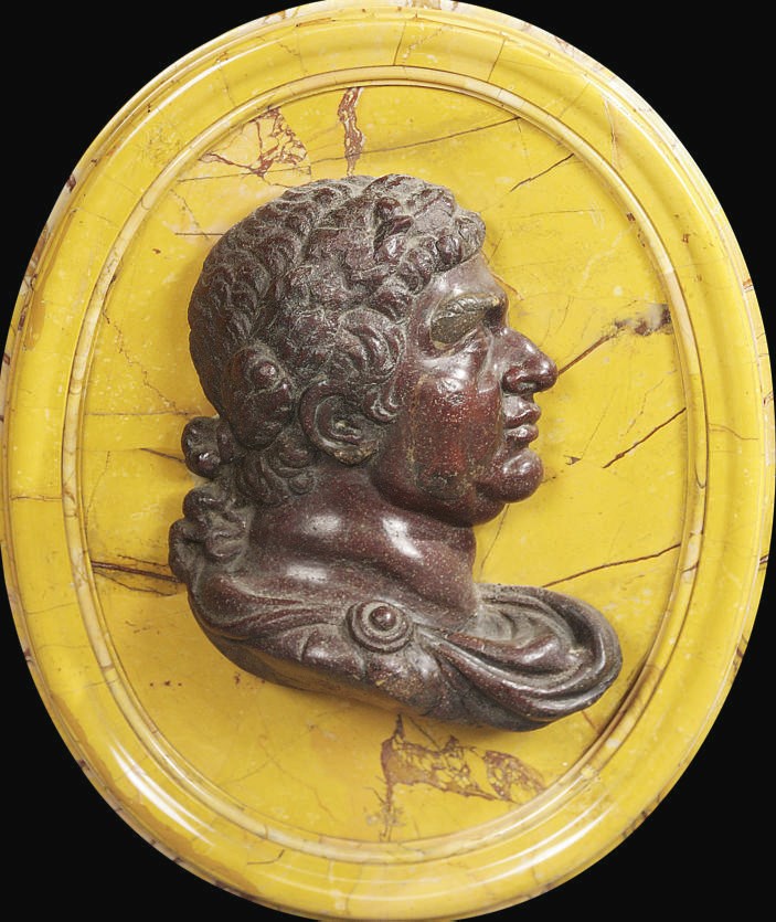AN ITALIAN PORPHYRY AND YELLOW SIENA MARBLE PROFILE MEDALLION